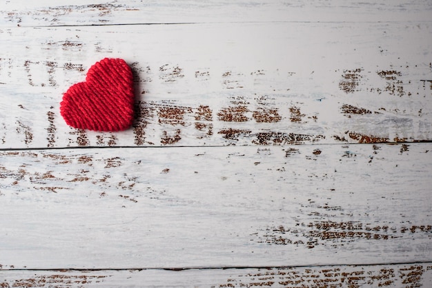 Top view Red heart on wall background