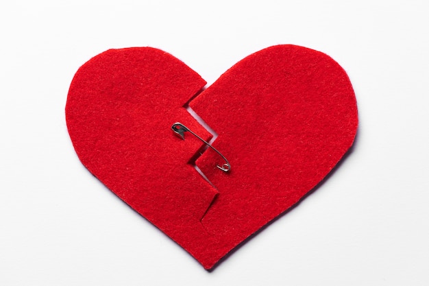 Free photo top view red heart with safety pin