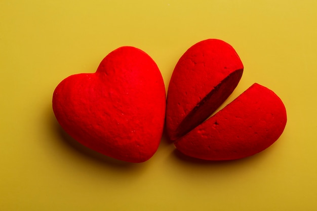 Top view red hearts on yellow background