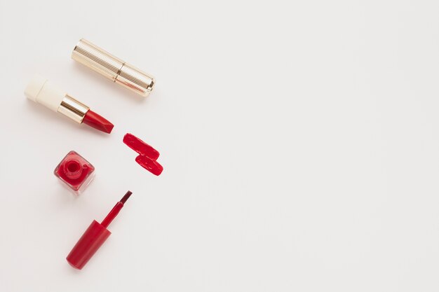 top view red lipstick and nail polish with copy-space