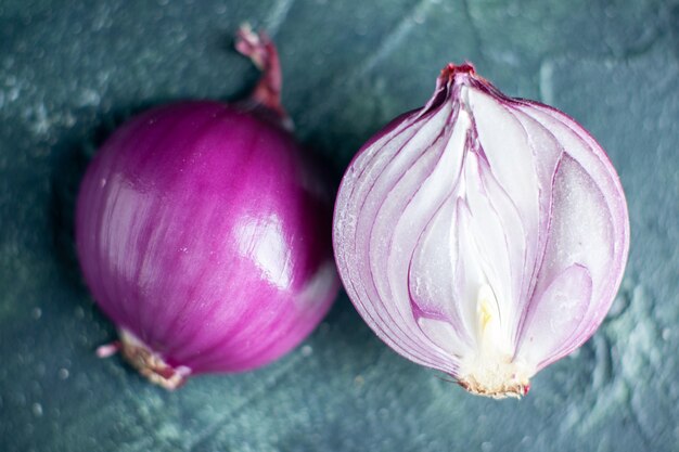 Top view red onion cut in half on dark background