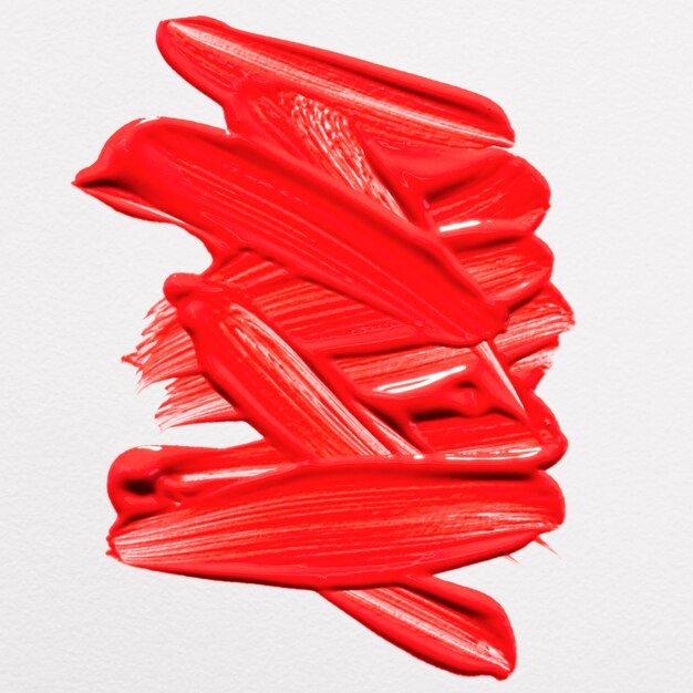 Top view of red paint brush strokes on surface