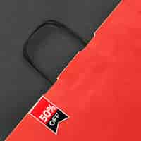 Free photo top view red shopping bag