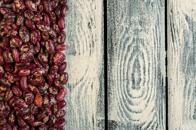 Top view of red speckled kidney beans with copy space