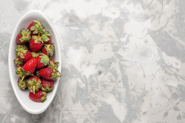 Top view red strawberries inside plate on white background berry fruit wild plant tree mellow