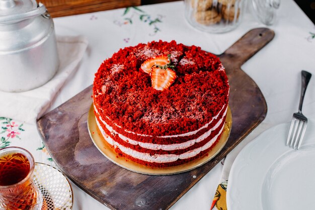 A top view red strawberry cake delicious with tea on the table fruit color cake biscuit sweet