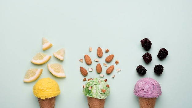 Free photo top view refreshing ice cream cones on the table