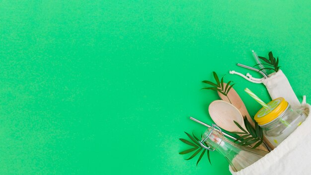 Top view of reusable bag with wooden spoons and copy space