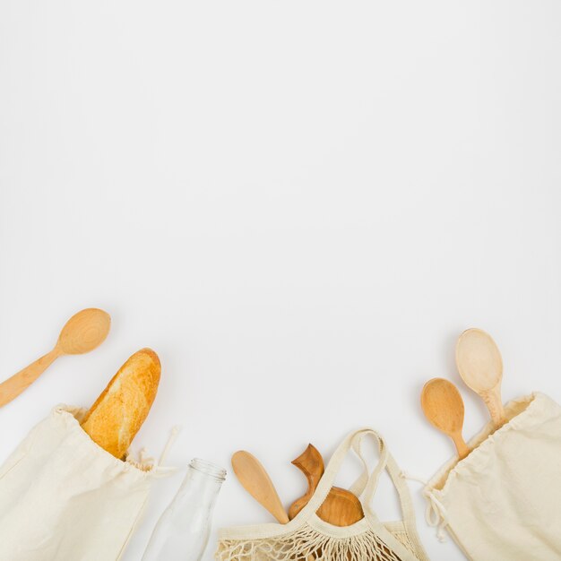 Top view of reusable bags with bread copy space