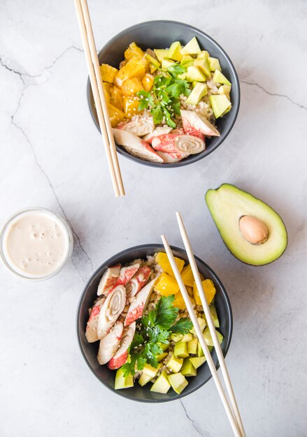 Top view rice bowls with avocado
