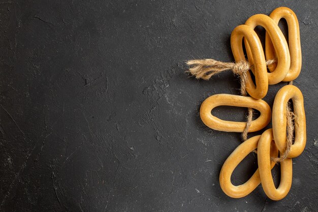 Top view of ring-shaped cookies with a rope tied to one another