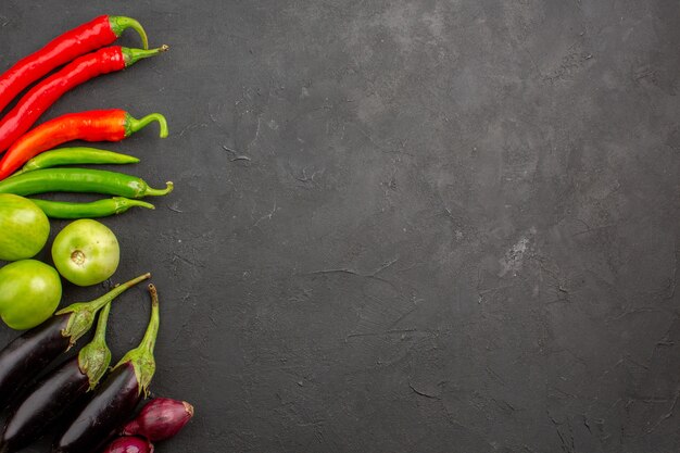 Top view ripe fresh vegetables on dark grey background