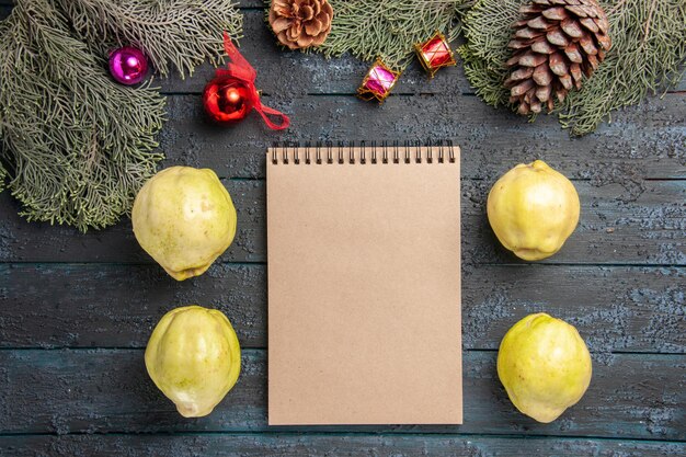 Top view ripe quinces fresh fruits on dark blue rustic desk many fresh plant ripe fruit tree