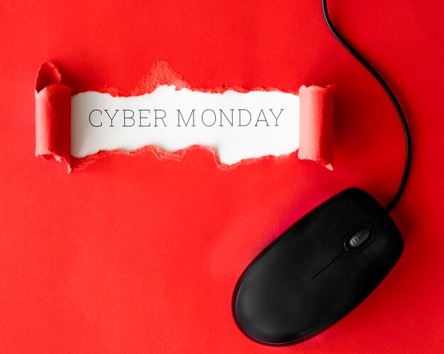 Top view of ripped paper with mouse for cyber monday