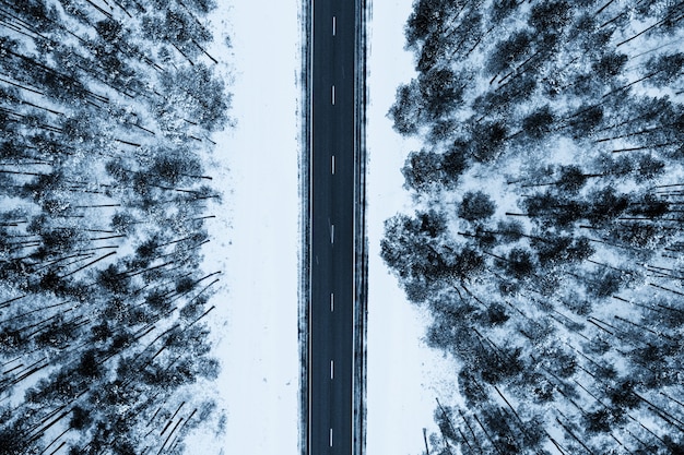 Top view of a road surrounded by snows