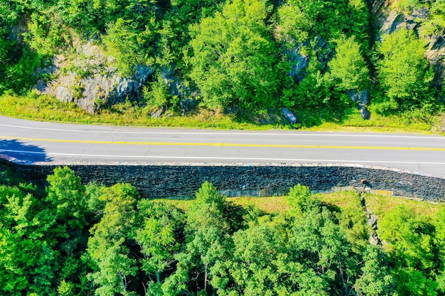 Top view of a road through the green woods in Virginia mountains