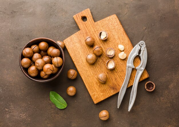 Top view roasted hazelnuts with cutting board