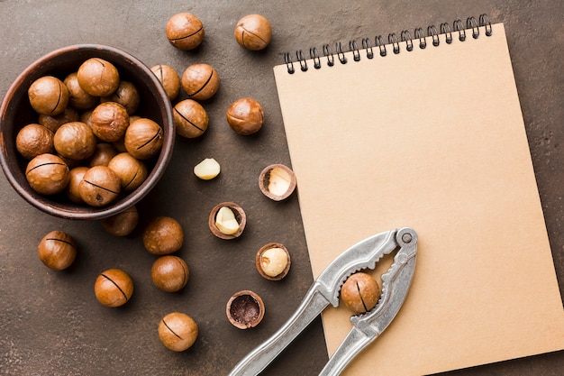 Top view roasted hazelnuts with notepad