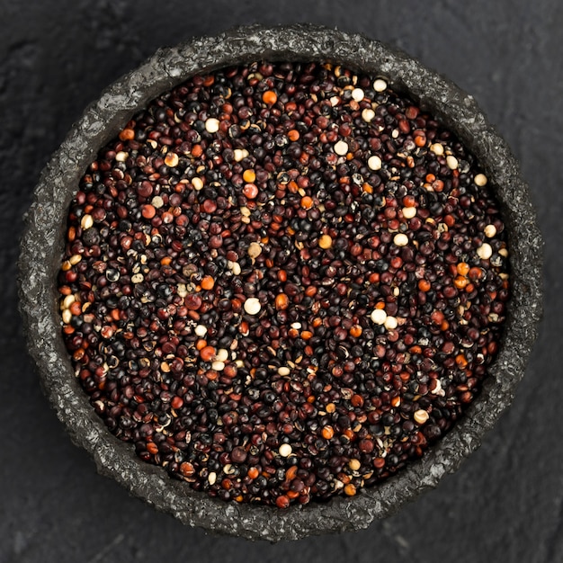 Top view of rock bowl with seeds