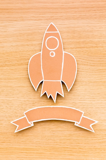 Free photo top view of rocket with ribbon for back to school season
