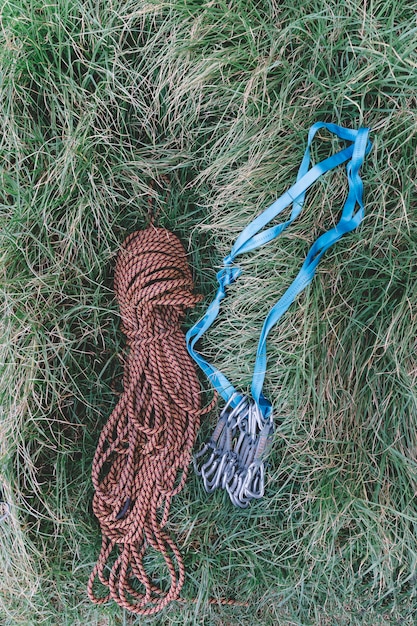 Top view of rope and carabiners in grass