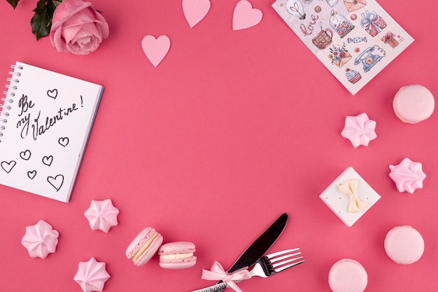 Top view of rose and macarons with meringue for valentines day