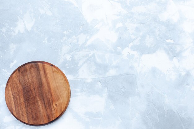 Top view round brown desk made from wood on the light background wood wooden light color food