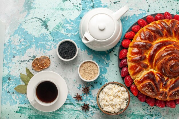 Top view round delicious pie with fresh strawberries on light blue surface