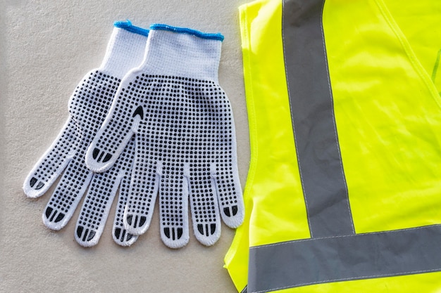 Top view safety gloves and vest