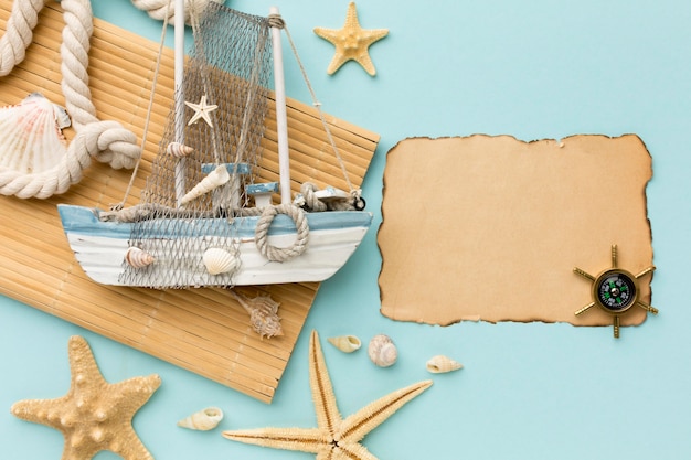 Top view sailing boat with compass on the table