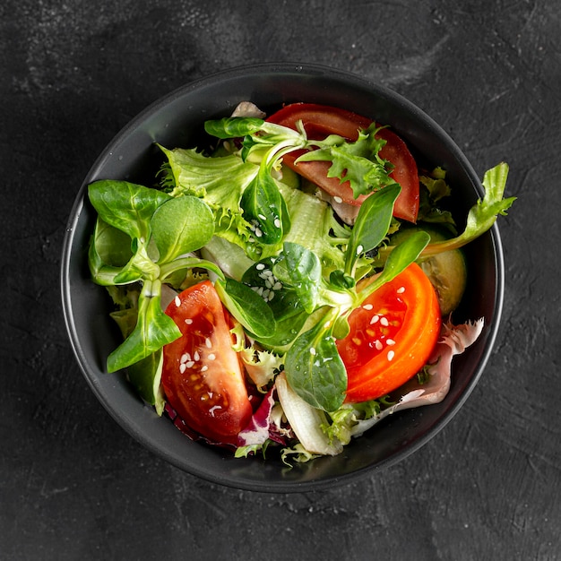 Top view salad in dark bowl