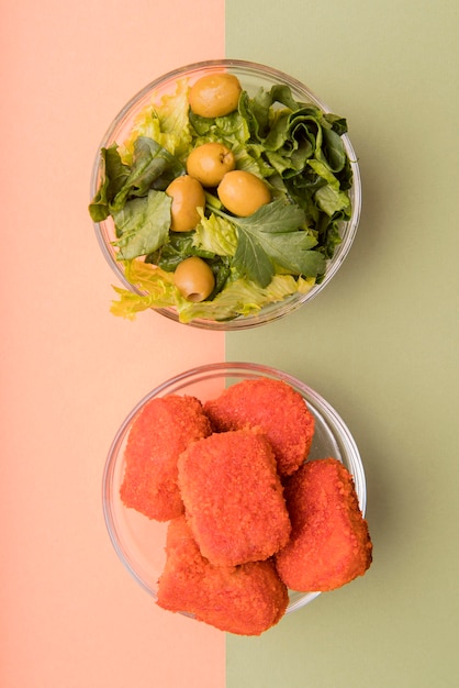 Top view salad versus unhealthy food