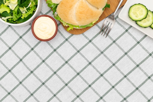 Free photo top view of salad with sandwich and copy space