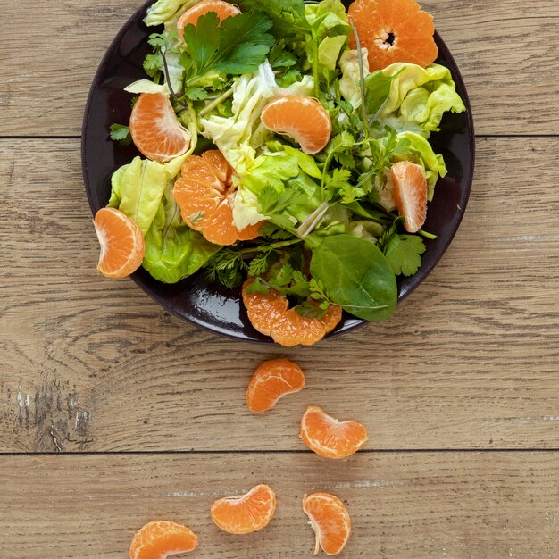 Top view salad with vegetables and fruit