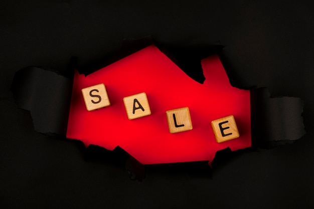 Top view of sale cubes through black paper