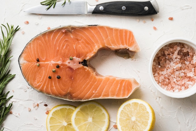 Top view salmon with spices and lemon