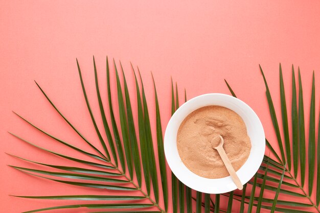 Top view sand in bowl and leaves