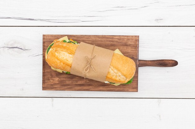 Top view of sandwich wrapped with paper