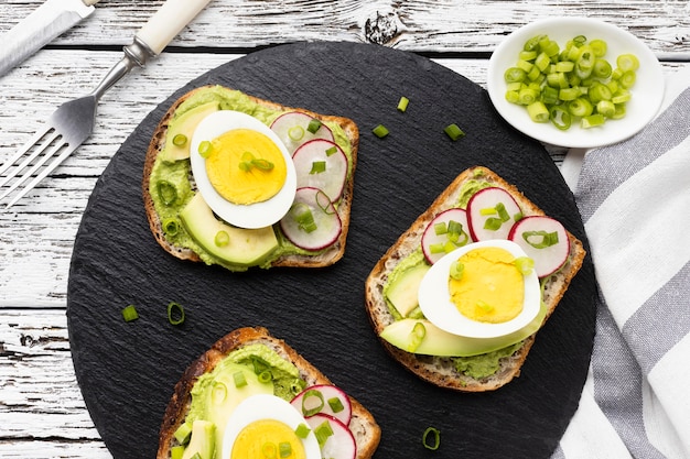 Top view of sandwiches with egg and avocado
