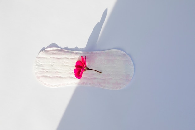 Top view sanitary towel with flower