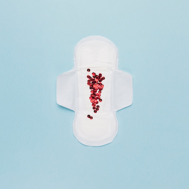 Top view sanitary towel with red sequins