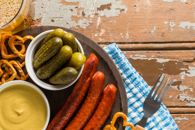 Free photo top view of sausages with beer and sausages