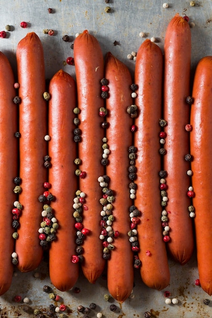 Top view sausages with pepper