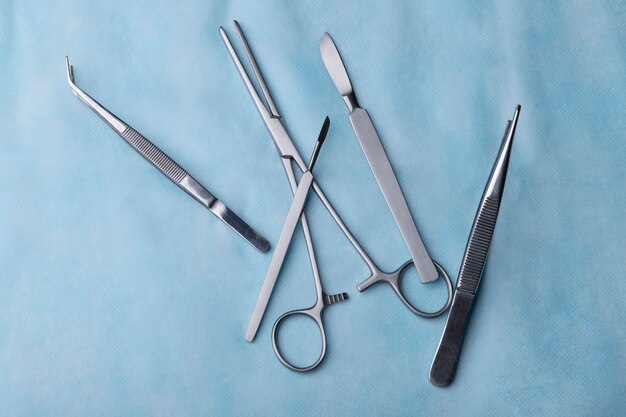 Top view of scalpel with other medical instruments