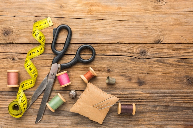 Top view of scissors with measuring tape and copy space