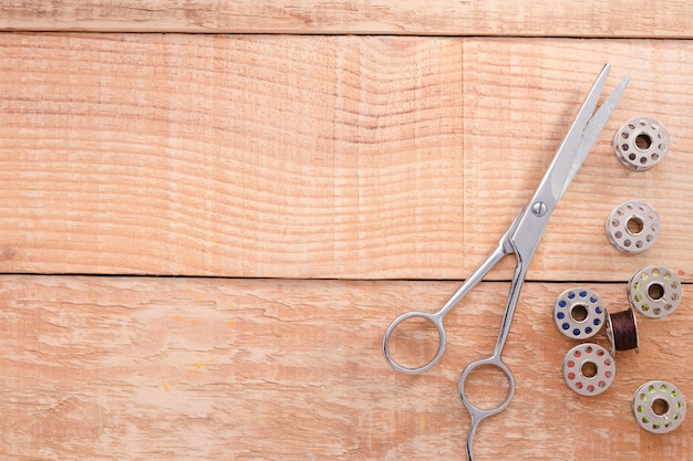 Top view of scissors with sewing machine shuttles