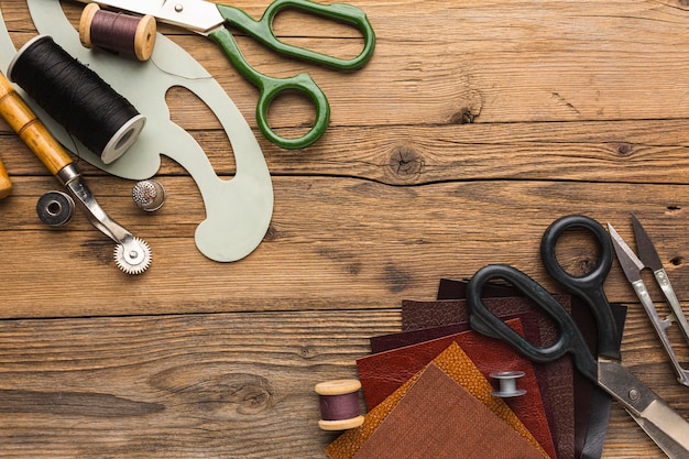 Top view of scissors with thread and thimble