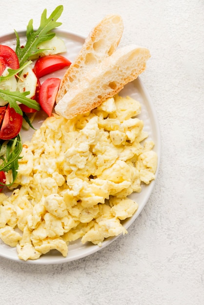 Free photo top view scrambled eggs with copy space