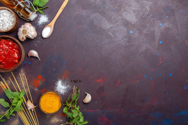 top view seasonings and sauce on the dark background meal spicy hot food color