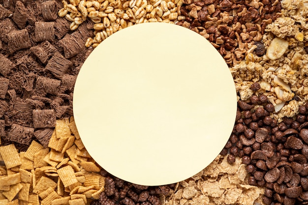 Top view of selection of breakfast cereals with empty bowl
